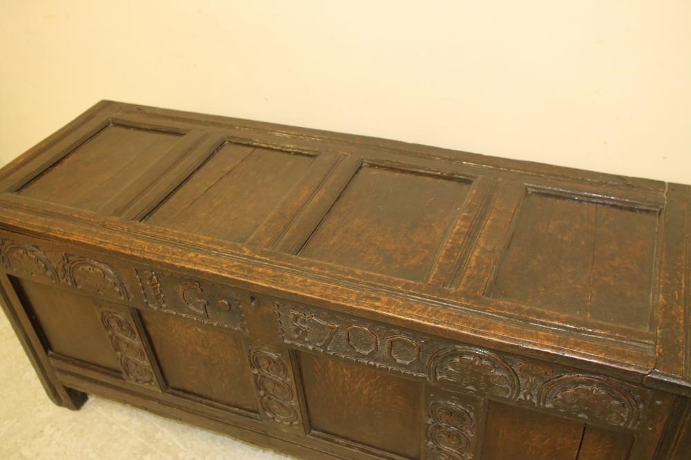 AN OAK PANELLED COFFER Image