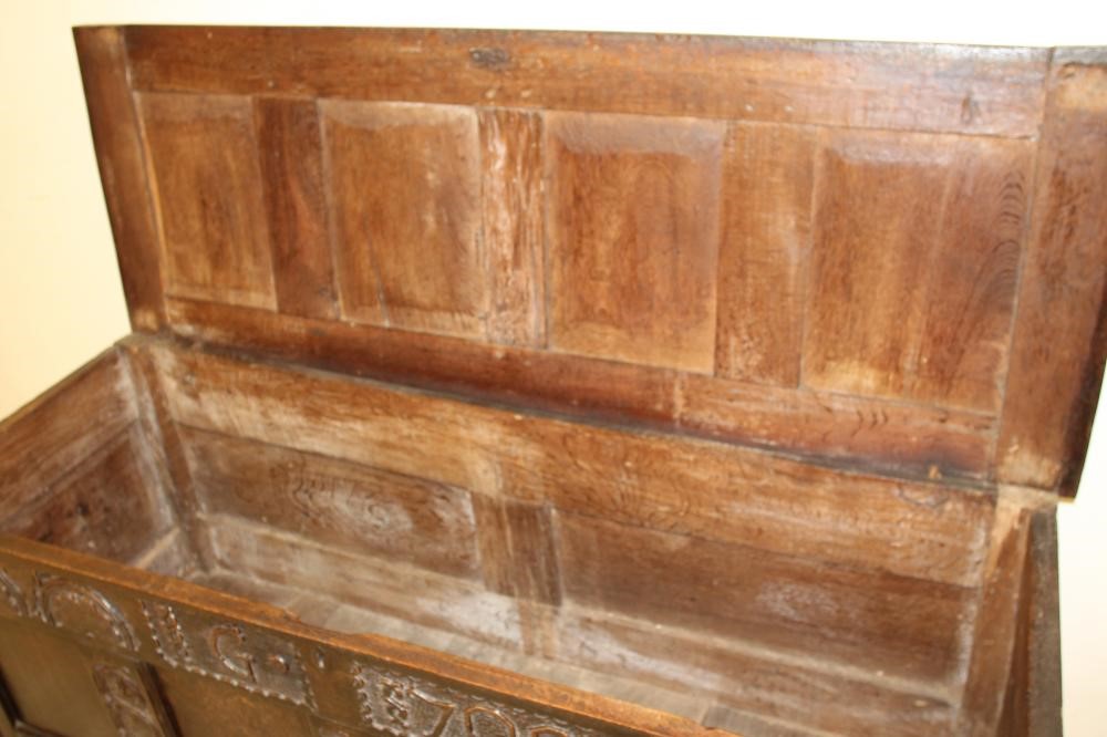 AN OAK PANELLED COFFER Image