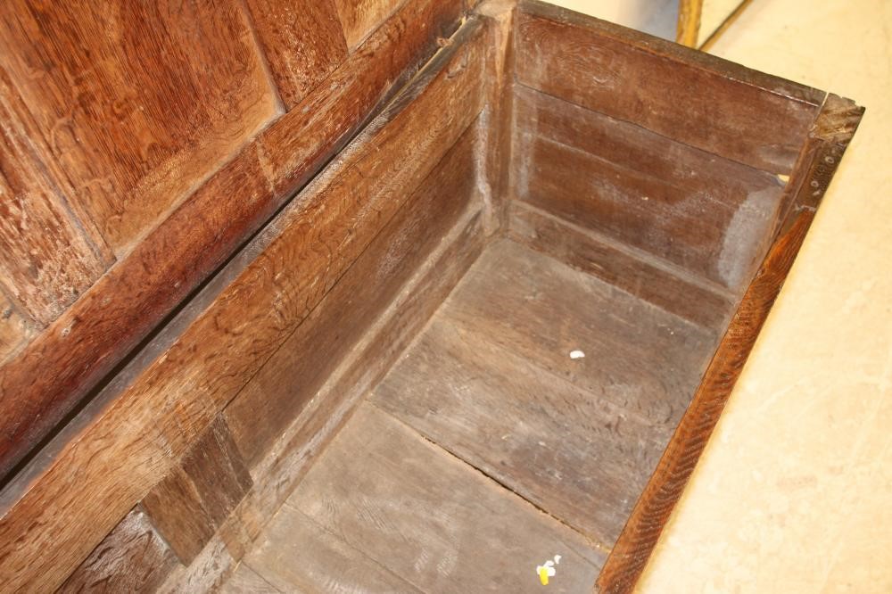 AN OAK PANELLED COFFER Image