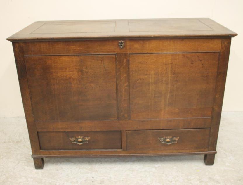 A GEORGIAN OAK FLUSH PANELLED CHEST Image