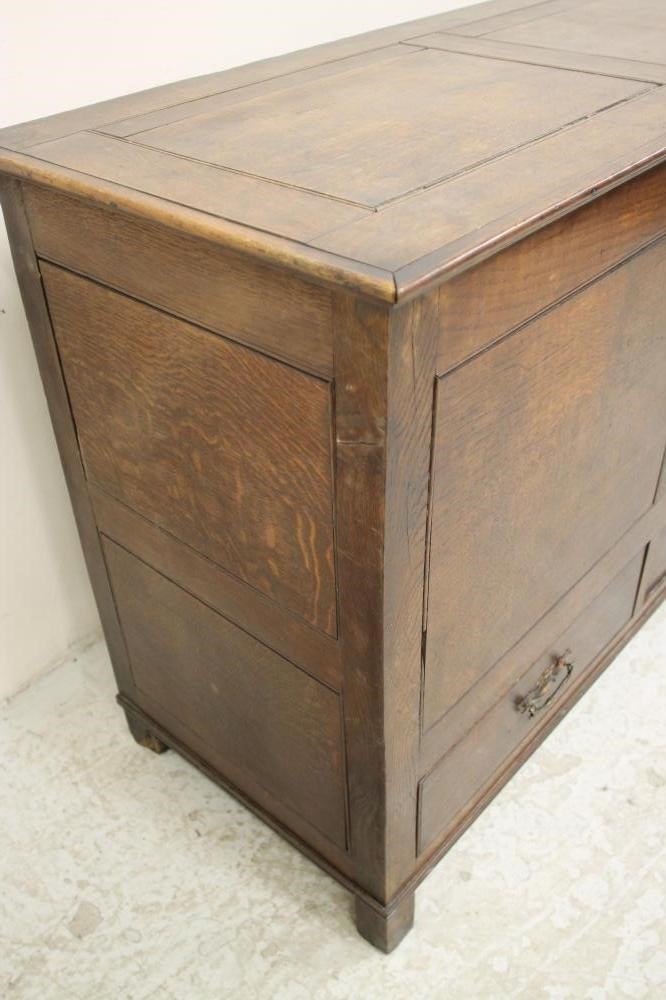 A GEORGIAN OAK FLUSH PANELLED CHEST Image