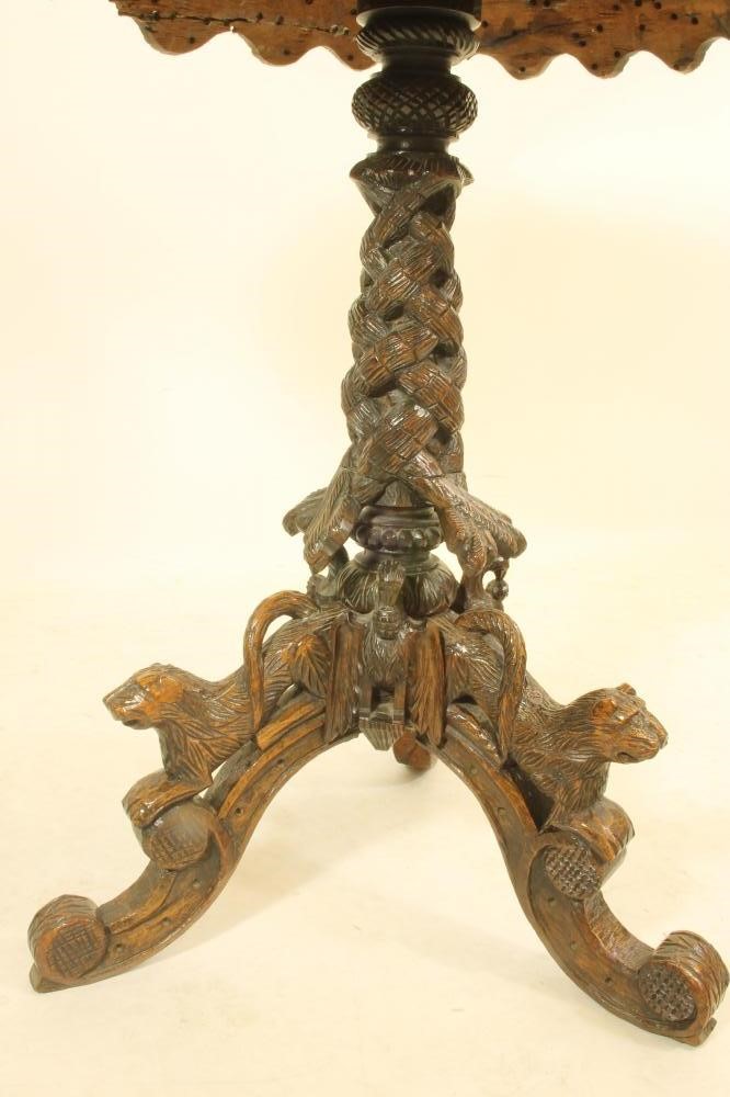A BURMESE CARVED HARDWOOD TRIPOD TABLE Image