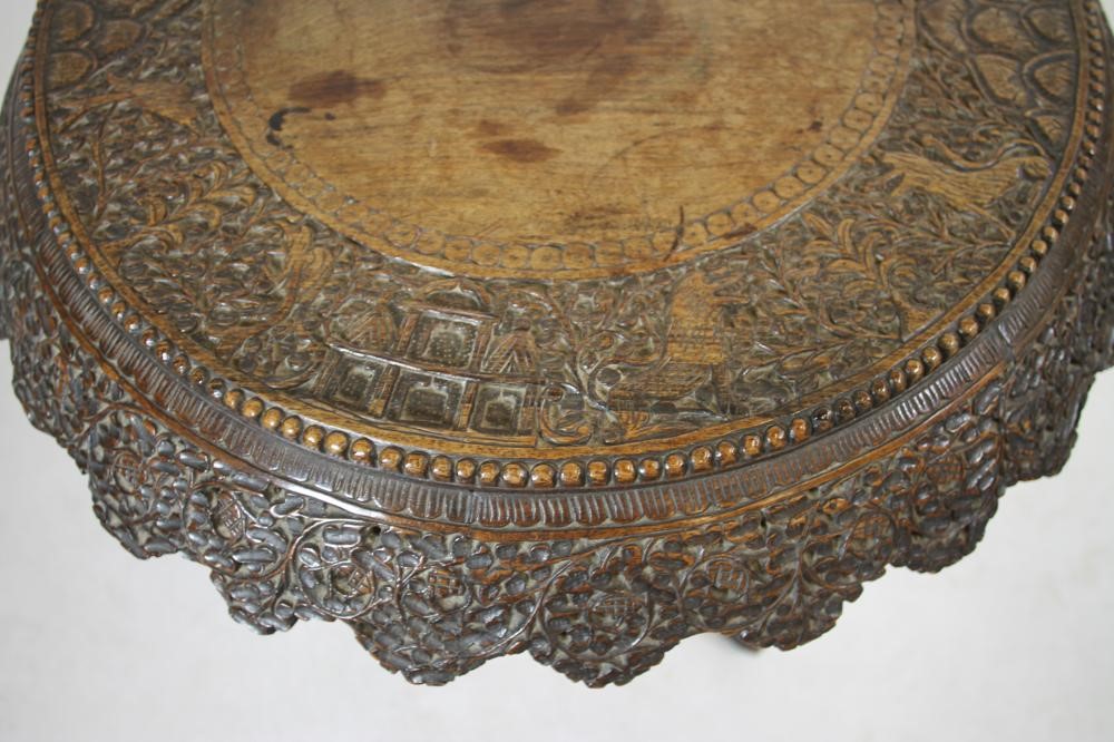A BURMESE CARVED HARDWOOD TRIPOD TABLE Image