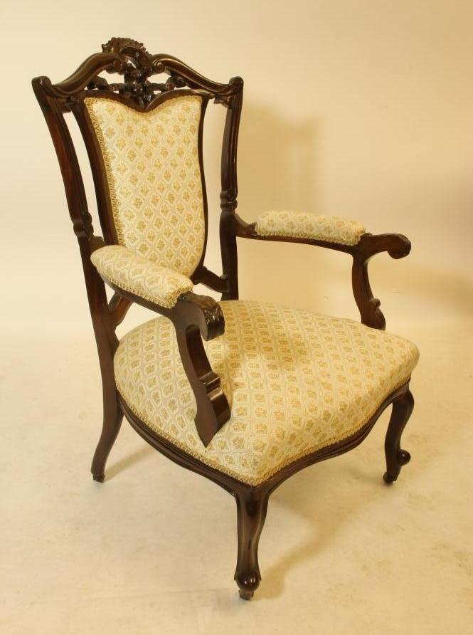 A VICTORIAN MAHOGANY FRAMED ELBOW CHAIR upholstered in ivory and gold weave Image
