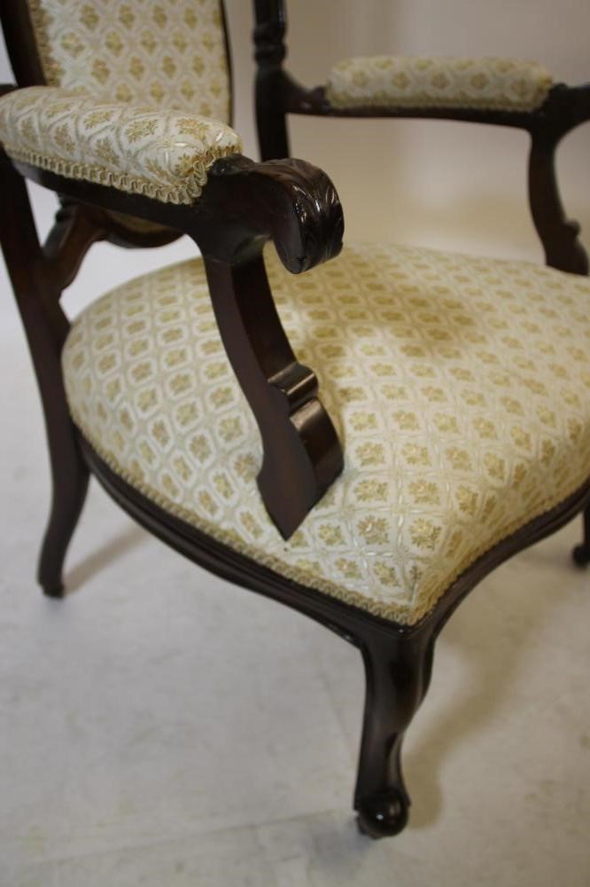 A VICTORIAN MAHOGANY FRAMED ELBOW CHAIR upholstered in ivory and gold weave Image