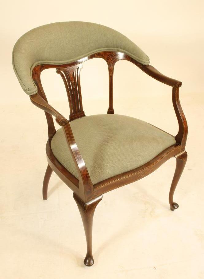 AN EDWARDIAN MAHOGANY ELBOW CHAIR of tub form with inset burr panels and stringing Image