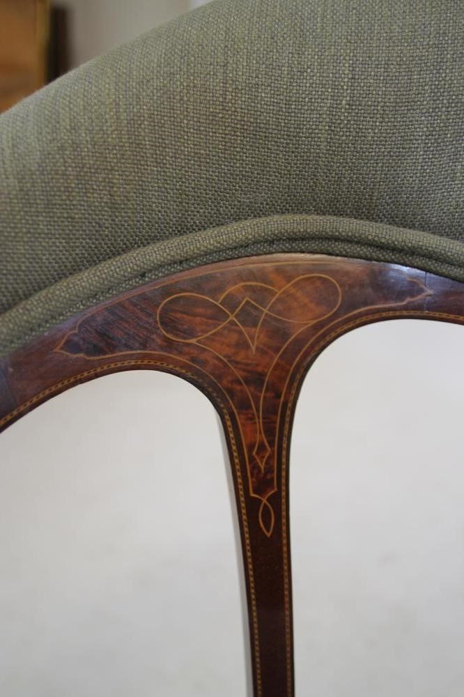 AN EDWARDIAN MAHOGANY ELBOW CHAIR of tub form with inset burr panels and stringing Image