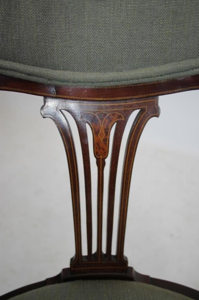AN EDWARDIAN MAHOGANY ELBOW CHAIR of tub form with inset burr panels and stringing Image