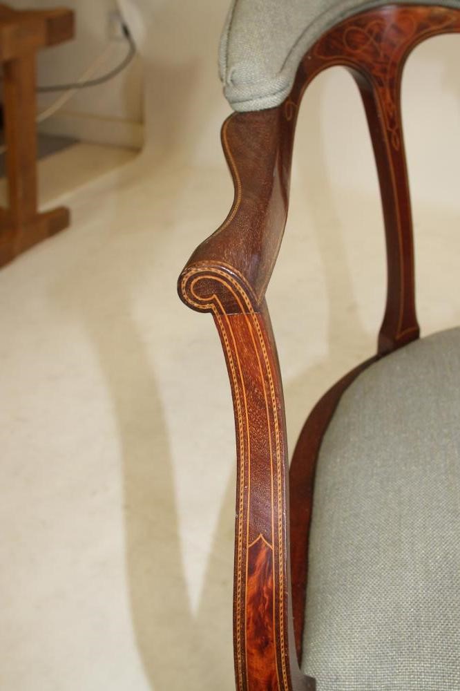 AN EDWARDIAN MAHOGANY ELBOW CHAIR of tub form with inset burr panels and stringing Image