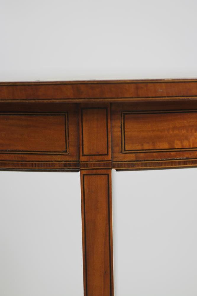 AN EDWARDIAN PAINTED SATINWOOD OCCASIONAL TABLE of circular form crossbanded with stringing Image