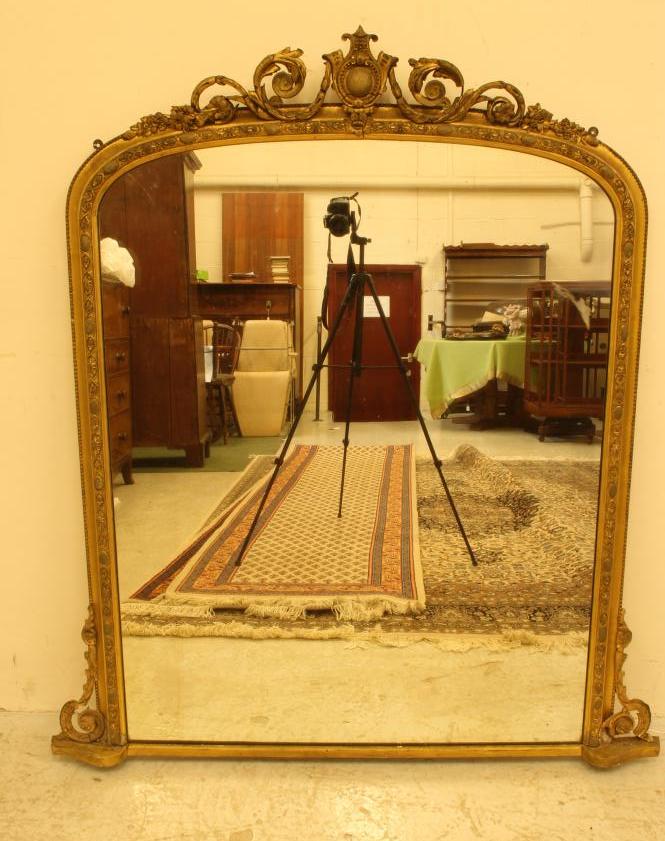 A VICTORIAN GILT GESSO OVERMANTEL of arched oblong form Image