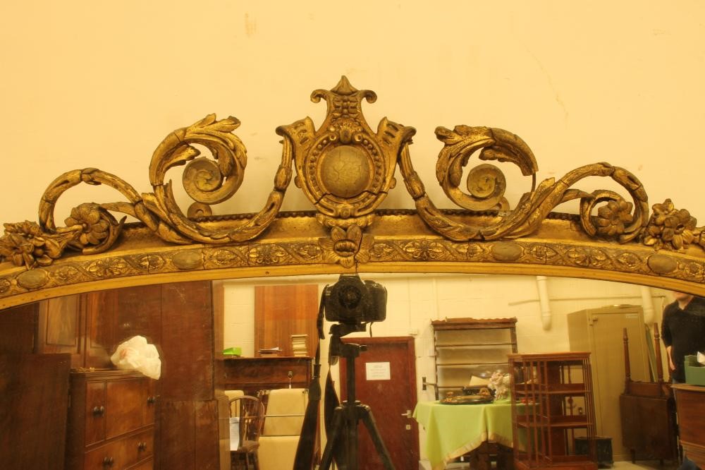 A VICTORIAN GILT GESSO OVERMANTEL of arched oblong form Image