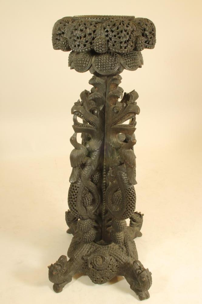 A BURMESE CARVED HARDWOOD JARDINIERE STAND Image