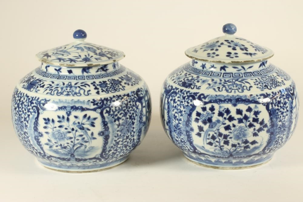 A PAIR OF CHINESE PORCELAIN JARS AND COVERS of squat cylindrical form with sloping shoulders Image