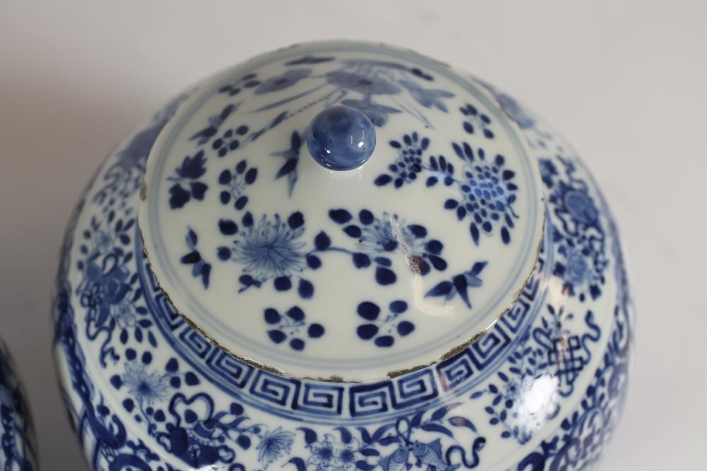 A PAIR OF CHINESE PORCELAIN JARS AND COVERS of squat cylindrical form with sloping shoulders Image