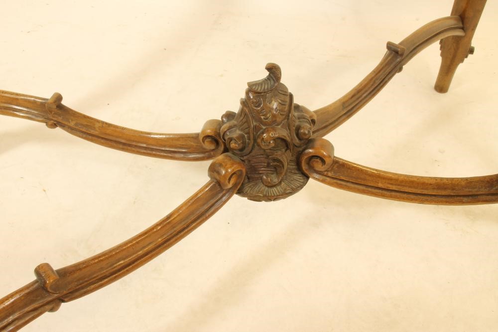 A CARVED WALNUT ROCOCO REVIVAL WRITING TABLE Image