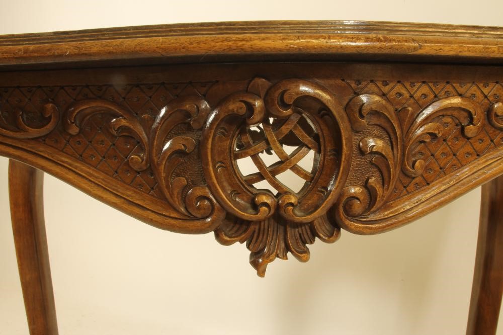 A CARVED WALNUT ROCOCO REVIVAL WRITING TABLE Image