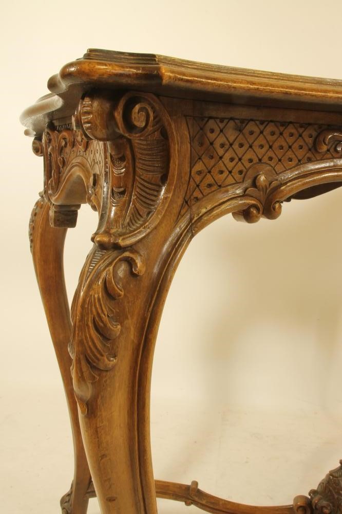 A CARVED WALNUT ROCOCO REVIVAL WRITING TABLE Image