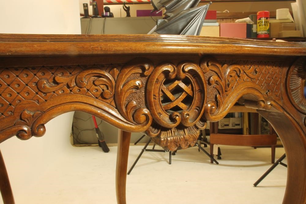 A CARVED WALNUT ROCOCO REVIVAL WRITING TABLE Image