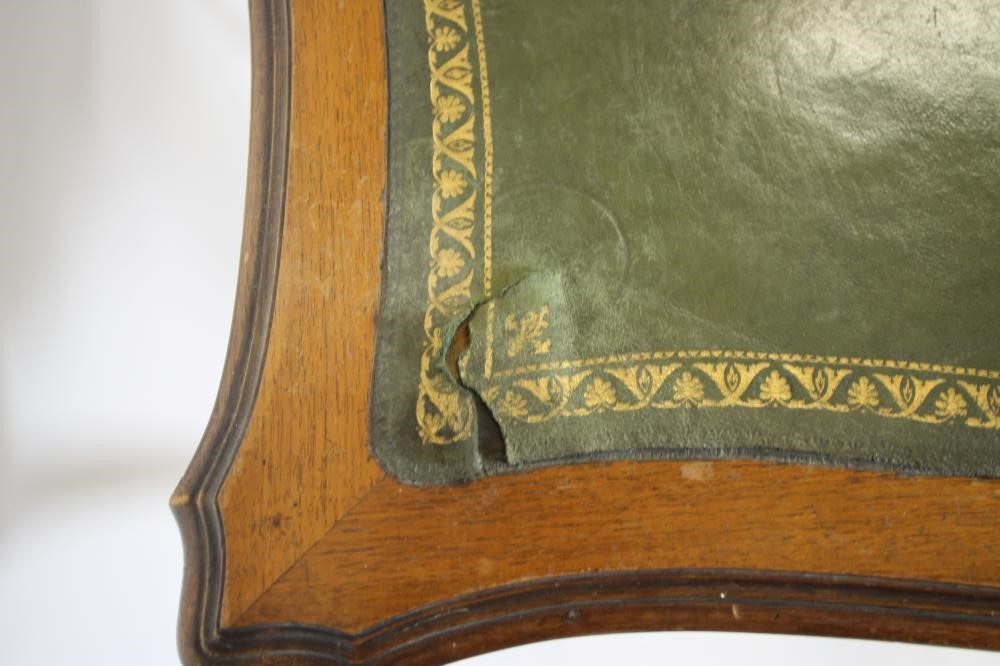 A CARVED WALNUT ROCOCO REVIVAL WRITING TABLE Image