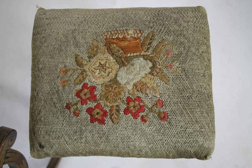 A REGENCY PAINTED X FRAMED STOOL of dished oblong form with faux bamboo side handles Image