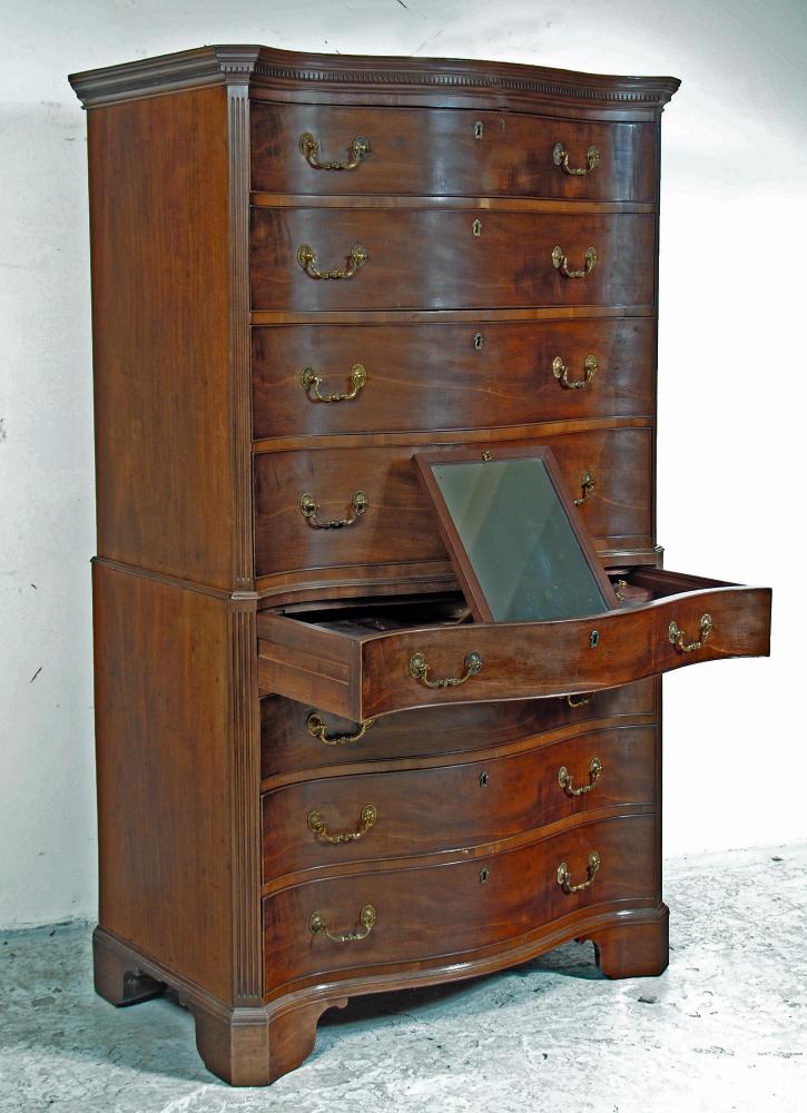 A GEORGE III MAHOGANY SERPENTINE FRONTED CHEST ON CHEST Image