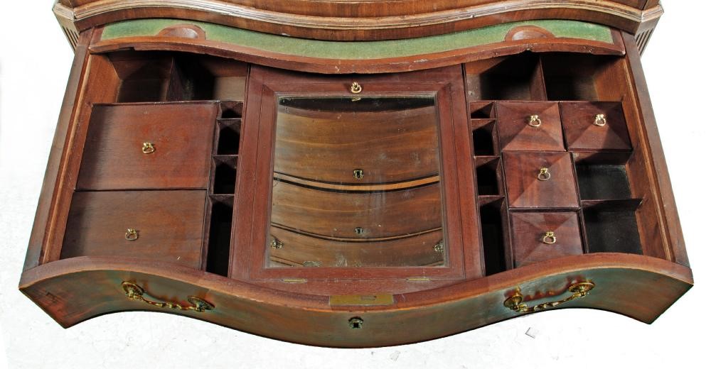 A GEORGE III MAHOGANY SERPENTINE FRONTED CHEST ON CHEST Image