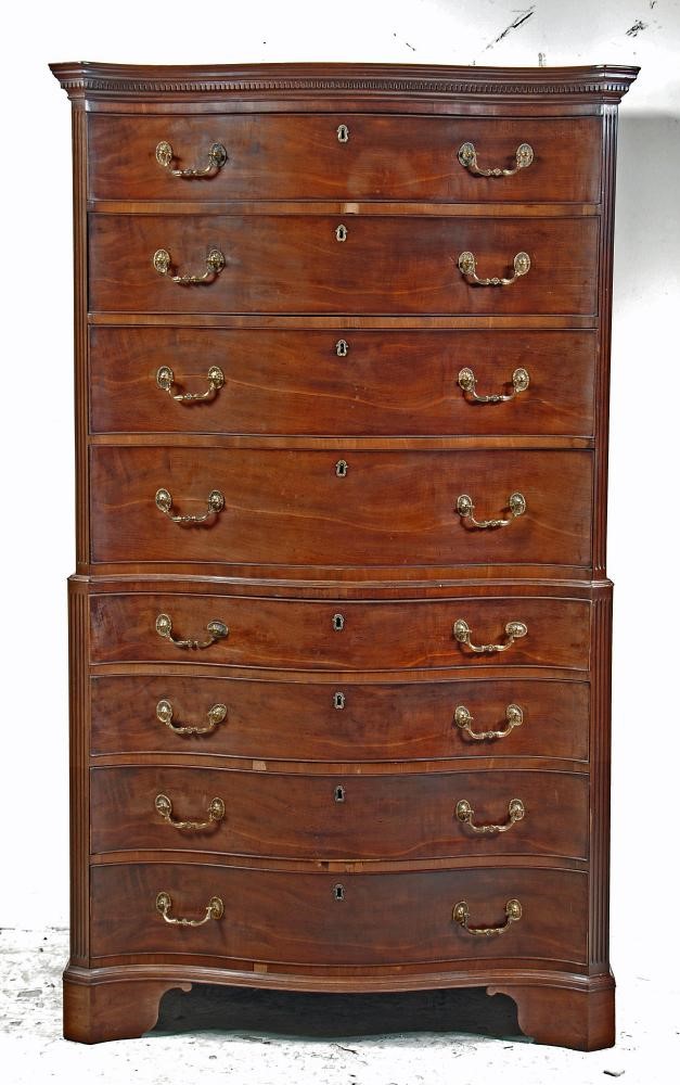 A GEORGE III MAHOGANY SERPENTINE FRONTED CHEST ON CHEST Image