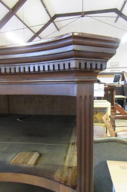 A GEORGE III MAHOGANY SERPENTINE FRONTED CHEST ON CHEST Image