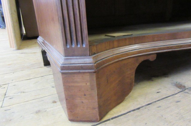 A GEORGE III MAHOGANY SERPENTINE FRONTED CHEST ON CHEST Image