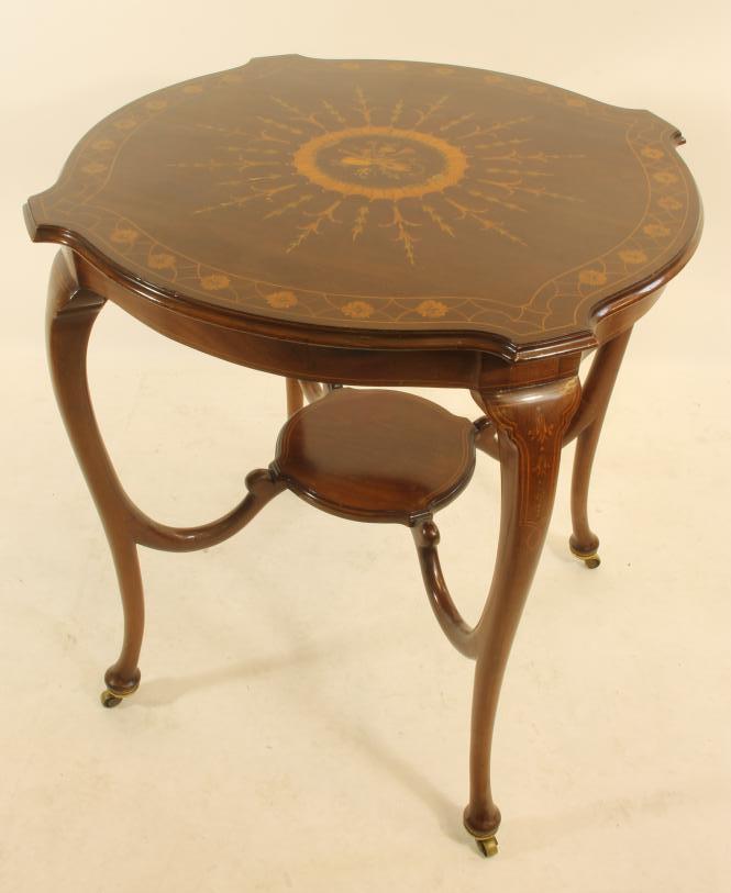 AN EDWARDIAN MAHOGANY AND MARQUETRY OCCASIONAL TABLE of earred circular form Image