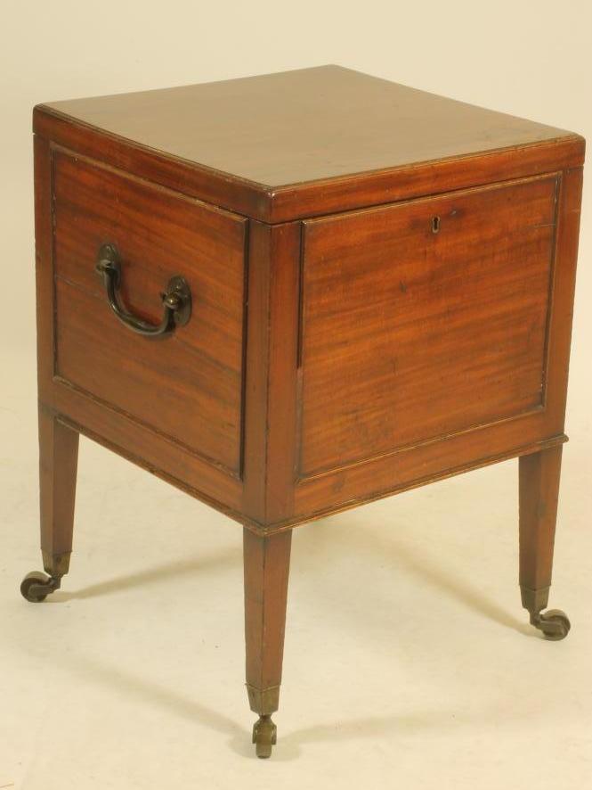 A GEORGIAN MAHOGANY CELLARETTE of square form with applied beaded panelling to the sides Image