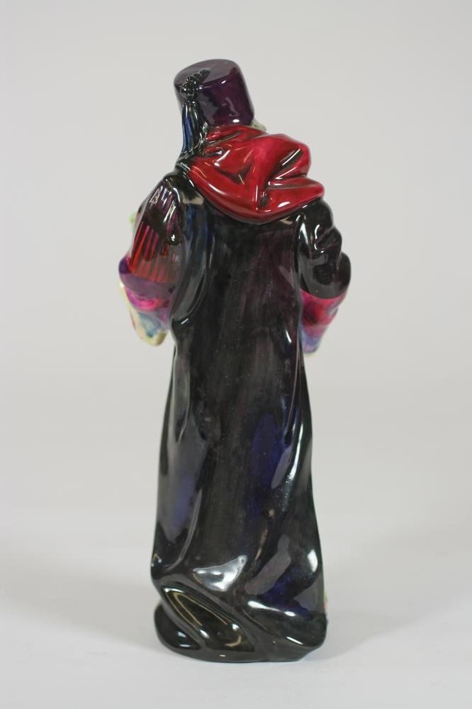 A ROYAL DOULTON EARTHENWARE FIGURE "The Alchemist" Image