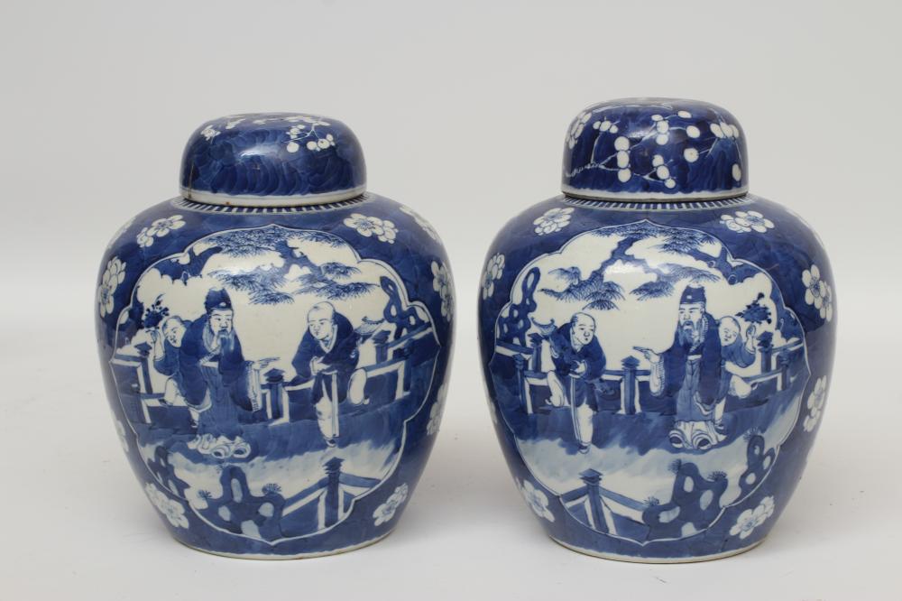A PAIR OF CHINESE PORCELAIN JARS AND COVERS painted in underglaze blue with minaret panels enclosing Image