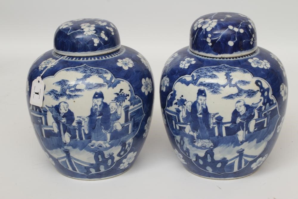 A PAIR OF CHINESE PORCELAIN JARS AND COVERS painted in underglaze blue with minaret panels enclosing Image