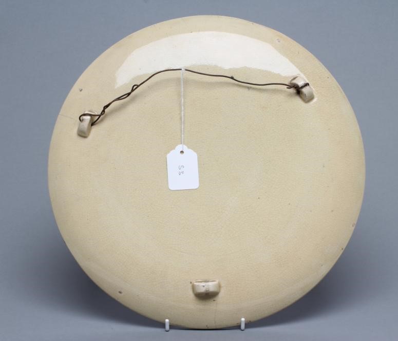 FREDERICK HURTEN RHEAD - an earthenware circular plaque Image