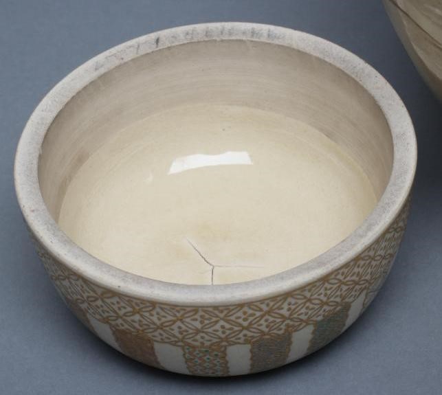 A SATSUMA EARTHENWARE JAR AND COVERS Image