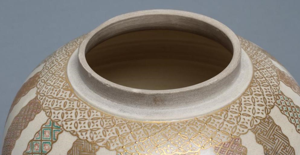 A SATSUMA EARTHENWARE JAR AND COVERS Image