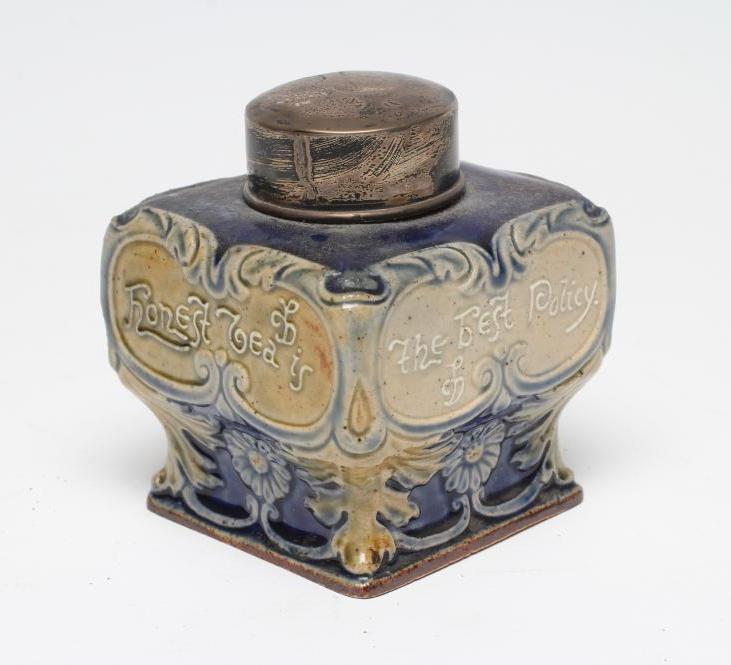 AN EDWARDIAN DOULTON LAMBETH STONEWARE TEA CANISTER of inverted square baluster form moulded with Image