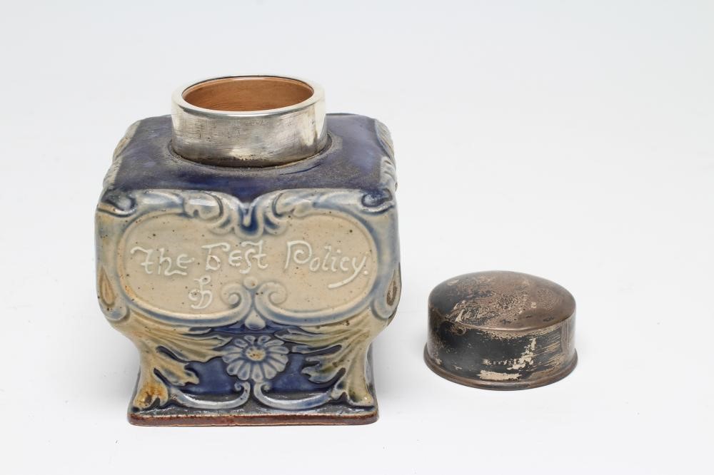 AN EDWARDIAN DOULTON LAMBETH STONEWARE TEA CANISTER of inverted square baluster form moulded with Image