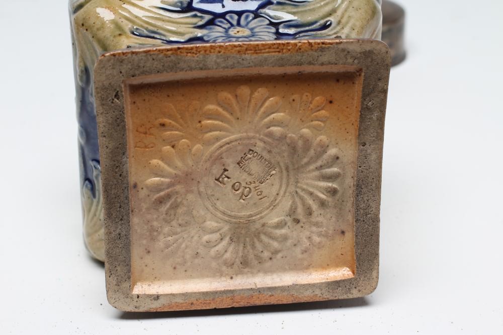 AN EDWARDIAN DOULTON LAMBETH STONEWARE TEA CANISTER of inverted square baluster form moulded with Image