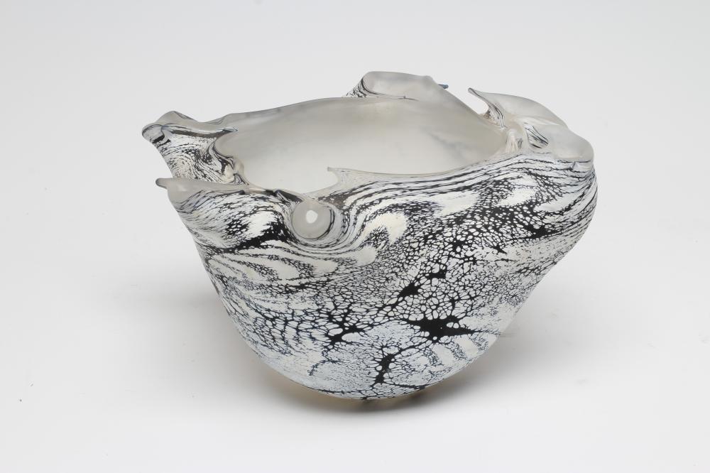 A PETER LAYTON FROSTED GLASS BOWL of abstract form with a dark blue dripped and mottled effect below Image