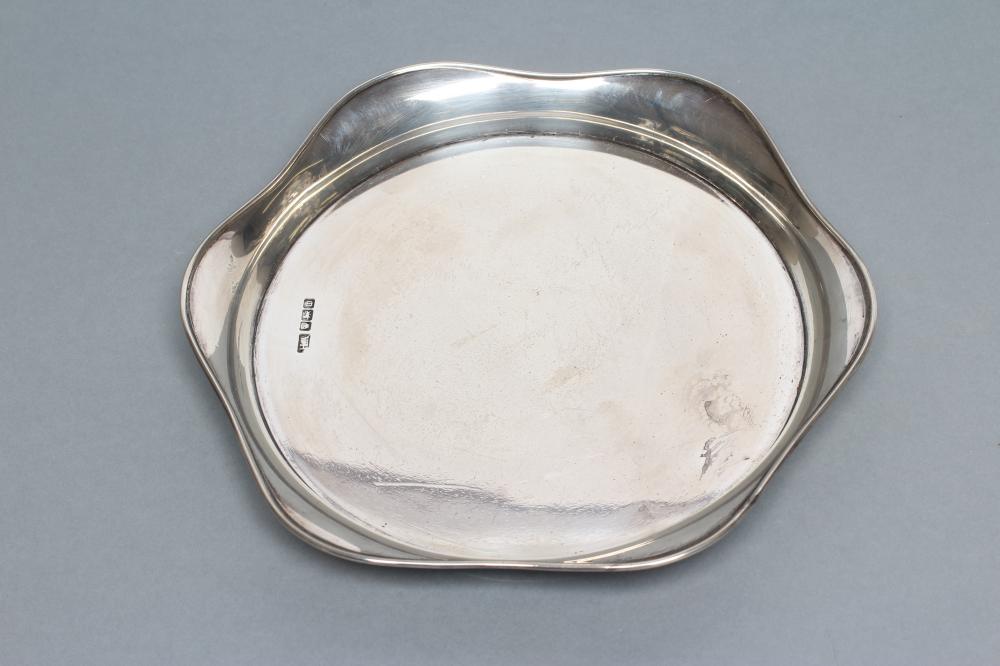 A SMALL CIRCULAR SILVER SALVER Image