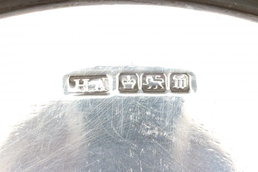 A SMALL CIRCULAR SILVER SALVER Image