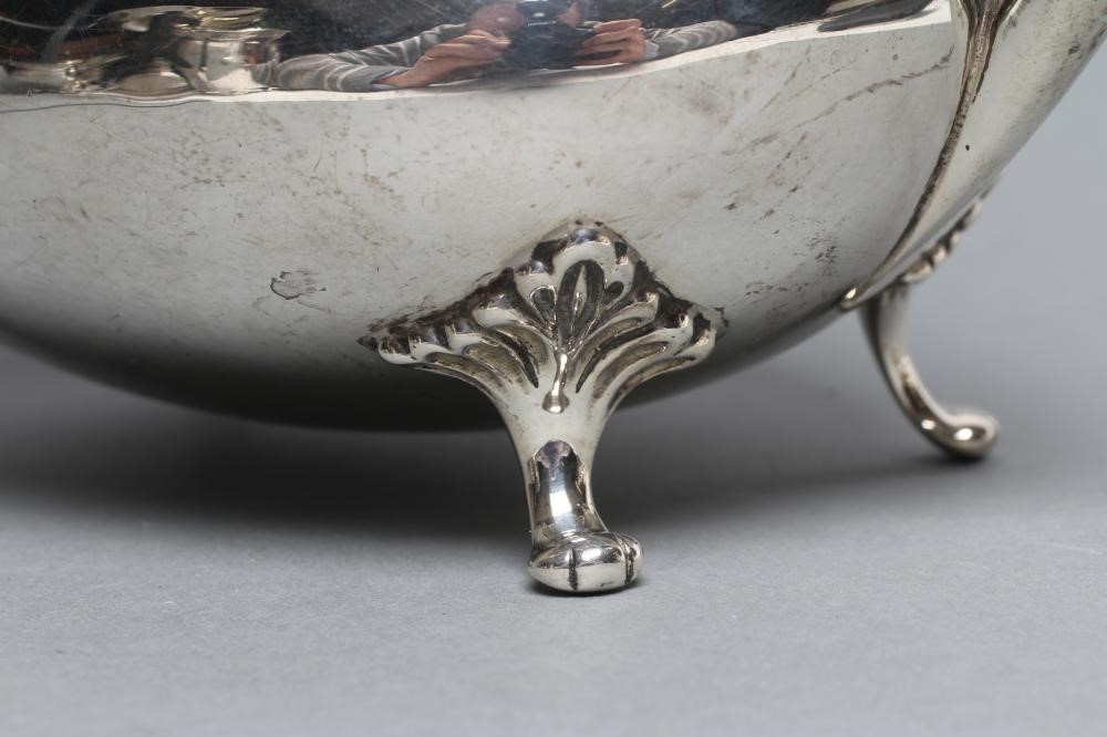 A SILVER COFFEE POT Image