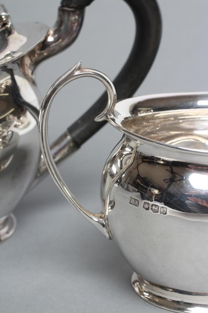 A SILVER BACHELOR'S TEAPOT AND SUGAR BASIN Image