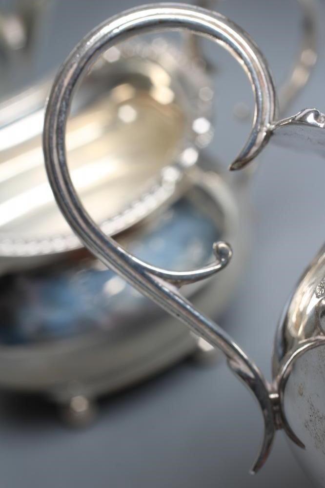 A FOUR PIECE SILVER TEA AND COFFEE SERVICE Image