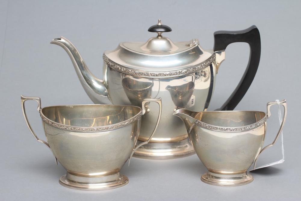 A SILVER THREE PIECE TEA SERVICE Image