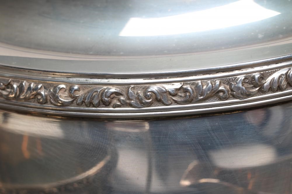 A SILVER THREE PIECE TEA SERVICE Image