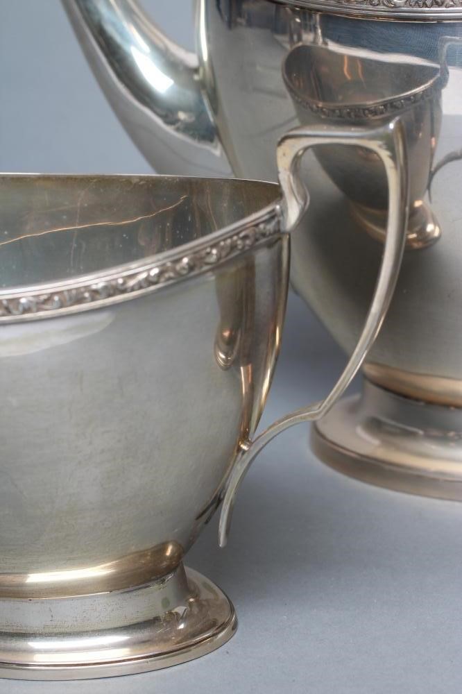 A SILVER THREE PIECE TEA SERVICE Image